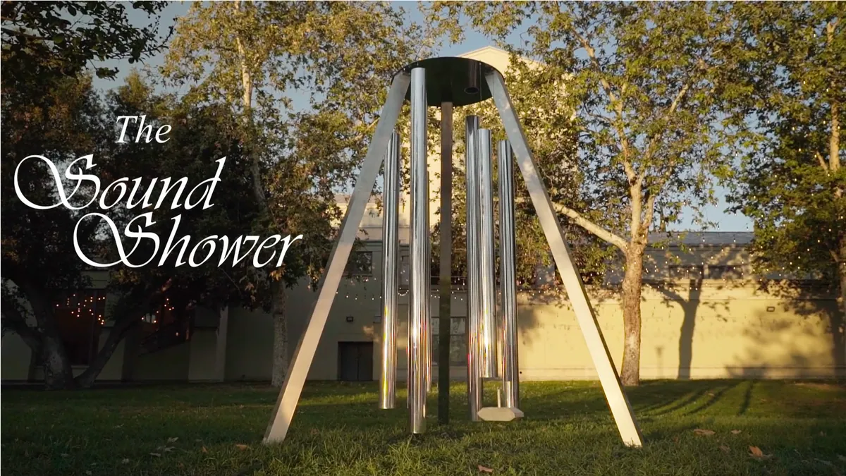 The Sound Shower, a tall outdoor sculpture made from suspended metal tubes
